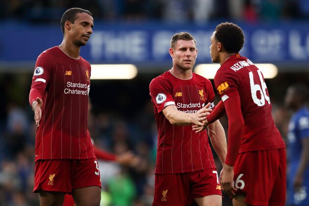 LONDON, ENGLAND - SEPTEMBER 22: Joel Matip and James Milner with Trent Alexander-Arnold of Liverpool at full time the Premier League match between Chelsea FC and Liverpool FC at Stamford Bridge on September 22, 2019 in London, United Kingdom. (Photo by James Williamson - AMA/Getty Images)