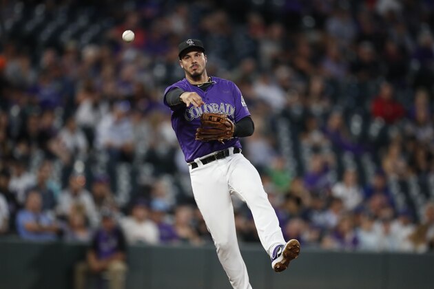 Colorado Rockies third baseman Nolan Arenado (28) in the third inning of a baseball game Tuesday, Sept. 17, 2019, in Denver. (AP Photo/David Zalubowski)