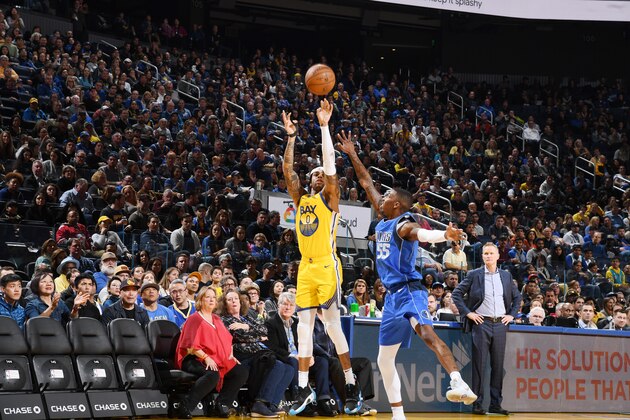 SAN FRANCISCO, CA - DECEMBER 28: D'Angelo Russell #0 of the Golden State Warriors shoots a three point basket during the game against the Dallas Mavericks on December 28, 2019 at Chase Center in San Francisco, California. NOTE TO USER: User expressly acknowledges and agrees that, by downloading and or using this photograph, user is consenting to the terms and conditions of Getty Images License Agreement. Mandatory Copyright Notice: Copyright 2019 NBAE (Photo by Noah Graham/NBAE via Getty Images)