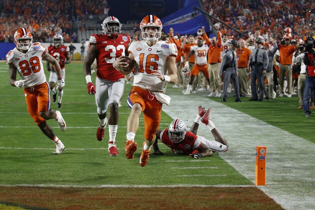 Clemson quarterback Trevor Lawrence runs in for a touchdown against Ohio State during the first half of the Fiesta Bowl NCAA college football playoff semifinal Saturday, Dec. 28, 2019, in Glendale, Ariz. (AP Photo/Ross D. Franklin)