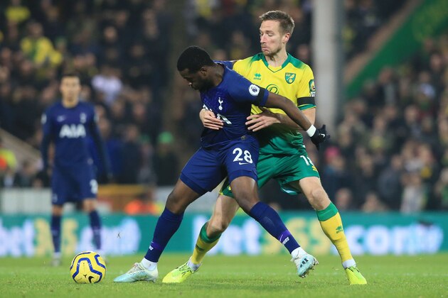 Tottenham Hotspur's French midfielder Tanguy Ndombele (L) tries to hold off Norwich City's German midfielder Marco Stiepermann (R) during the English Premier League football match between Norwich City and Tottenham Hotspur at Carrow Road in Norwich, eastern England on December 28, 2019. (Photo by Lindsey Parnaby / AFP) / RESTRICTED TO EDITORIAL USE. No use with unauthorized audio, video, data, fixture lists, club/league logos or 'live' services. Online in-match use limited to 120 images. An additional 40 images may be used in extra time. No video emulation. Social media in-match use limited to 120 images. An additional 40 images may be used in extra time. No use in betting publications, games or single club/league/player publications. /  (Photo by LINDSEY PARNABY/AFP via Getty Images)
