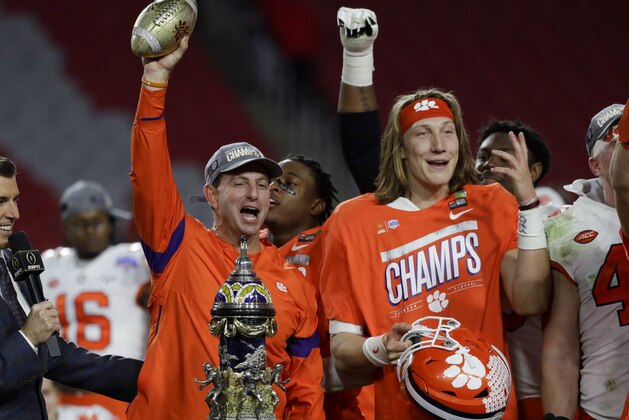 Clemson coach Dabo Swinney and quarterback Trevor Lawrence celebrate after Clemson defeated Ohio State 29-23 in the Fiesta Bowl NCAA college football playoff semifinal Saturday, Dec. 28, 2019, in Glendale, Ariz. (AP Photo/Rick Scuteri)