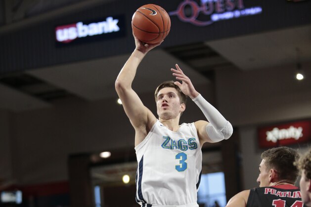 SPOKANE, WASHINGTON - DECEMBER 21: Filip Petrusev #3 of the Gonzaga Bulldogs puts up a shot against Mason Peatling #14 of the Eastern Washington Eagles in the first half at McCarthey Athletic Center on December 21, 2019 in Spokane, Washington. (Photo by William Mancebo/Getty Images)