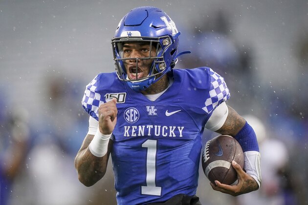 FILE - In this Nov. 30, 2019, file photo, Kentucky quarterback Lynn Bowden Jr. (1) runs for a touchdown during the first half of the NCAA college football game against Louisville, in Lexington, Ky. Bowden was selected to The Associated Press All-America team, Monday, Dec. 16, 2019. (AP Photo/Bryan Woolston, File)