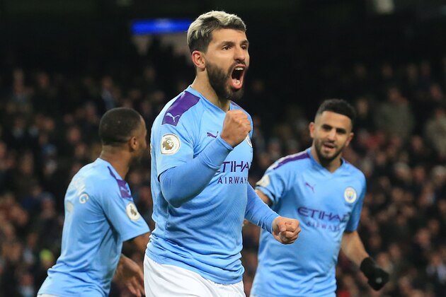 Manchester City's Argentinian striker Sergio Aguero (C) celebrates scoring the opening goal during the English Premier League football match between Manchester City and Sheffield United at the Etihad Stadium in Manchester, north west England, on December 29, 2019. (Photo by Lindsey Parnaby / AFP) / RESTRICTED TO EDITORIAL USE. No use with unauthorized audio, video, data, fixture lists, club/league logos or 'live' services. Online in-match use limited to 120 images. An additional 40 images may be used in extra time. No video emulation. Social media in-match use limited to 120 images. An additional 40 images may be used in extra time. No use in betting publications, games or single club/league/player publications. /  (Photo by LINDSEY PARNABY/AFP via Getty Images)