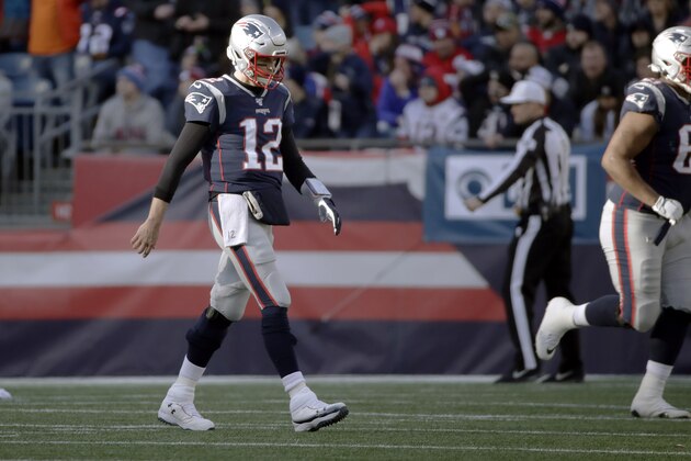 New England Patriots quarterback Tom Brady walks to the sideline after throwing an interception to Miami Dolphins cornerback Eric Rowe, who ran it back for a touchdown in the first half of an NFL football game, Sunday, Dec. 29, 2019, in Foxborough, Mass. (AP Photo/Elise Amendola)
