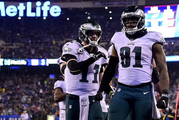 EAST RUTHERFORD, NEW JERSEY - DECEMBER 29: Josh Perkins #81 of the Philadelphia Eagles celebrates with Carson Wentz #11 after scoring a touchdown against the New York Giants during the second quarter in the game at MetLife Stadium on December 29, 2019 in East Rutherford, New Jersey. (Photo by Steven Ryan/Getty Images)