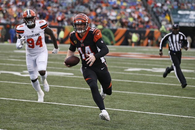 Cincinnati Bengals quarterback Andy Dalton (14) rushes for a 5-yard touchdown during the first half of an NFL football game against the Cleveland Browns, Sunday, Dec. 29, 2019, in Cincinnati. Browns defensive end Bryan Cox (94) watches. (AP Photo/Gary Landers) Cincinnati Bengals quarterback Andy Dalton (14) rushes for a 5-yard touchdown during the first half of an NFL football game against the Cleveland Browns, Sunday, Dec. 29, 2019, in Cincinnati. Browns defensive end Bryan Cox (94) watches. (AP Photo/Gary Landers)