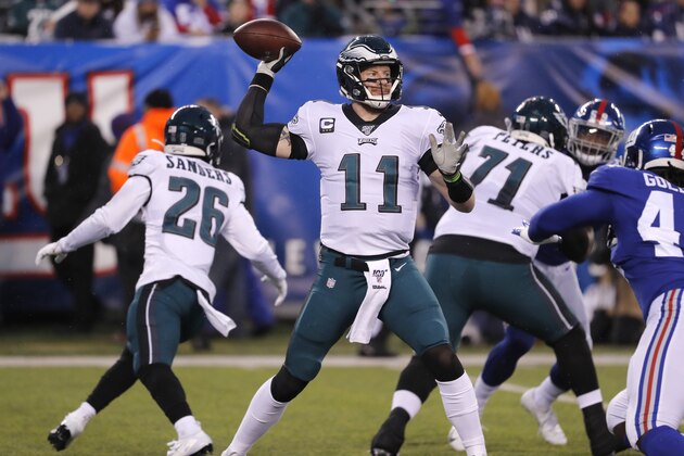 Philadelphia Eagles quarterback Carson Wentz (11) looks to pass in the first half of an NFL football game against the New York Giants, Sunday, Dec. 29, 2019, in East Rutherford, N.J. (AP Photo/Seth Wenig)