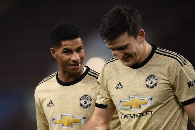 Manchester United's English striker Marcus Rashford (L) and Manchester United's English defender Harry Maguire (R) leave the pitch at the end of the English Premier League football match between Burnley and Manchester United at Turf Moor in Burnley, north west England on December 28, 2019. (Photo by Oli SCARFF / AFP) / RESTRICTED TO EDITORIAL USE. No use with unauthorized audio, video, data, fixture lists, club/league logos or 'live' services. Online in-match use limited to 120 images. An additional 40 images may be used in extra time. No video emulation. Social media in-match use limited to 120 images. An additional 40 images may be used in extra time. No use in betting publications, games or single club/league/player publications. /  (Photo by OLI SCARFF/AFP via Getty Images)