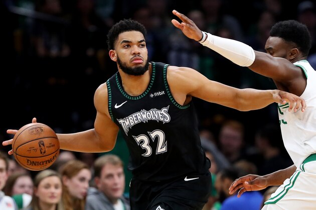 BOSTON, MASSACHUSETTS - JANUARY 02: Jaylen Brown #7 of the Boston Celtics defends Karl-Anthony Towns #32 of the Minnesota Timberwolves at TD Garden on January 02, 2019 in Boston, Massachusetts. NOTE TO USER: User expressly acknowledges and agrees that, by downloading and or using this photograph, User is consenting to the terms and conditions of the Getty Images License Agreement. (Photo by Maddie Meyer/Getty Images)