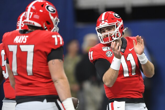 Georgia quarterback Jake Fromm (11) warms up before the first half of the Southeastern Conference championship NCAA college football game between LSU and Georgia, Saturday, Dec. 7, 2019, in Atlanta. (AP Photo/John Amis)