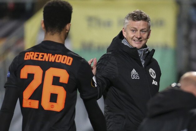 THE HAGUE, NETHERLANDS - OCTOBER 3: Coach of Manchester United Ole Gunnar Solskjaer greets Mason Greenwood of Manchester United when he's replaced during the UEFA Europa League group L match between AZ Alkmaar and Manchester United (Man U) at ADO Den Haag stadium (Cars Jeans Stadion) on October 3, 2019 in The Hague, Den Haag, Netherlands. (Photo by Jean Catuffe/Getty Images)