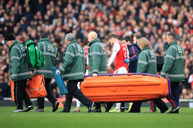 LONDON, ENGLAND - DECEMBER 29: Callum Chambers of Arsenal leaves the game injured during the Premier League match between Arsenal FC and Chelsea FC at Emirates Stadium on December 29, 2019 in London, United Kingdom. (Photo by Marc Atkins/Getty Images)