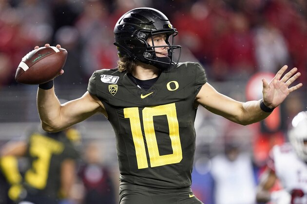 Oregon quarterback Justin Herbert throws a pass against Utah during the second half of the Pac-12 Conference championship NCAA college football game in Santa Clara, Calif., Friday, Dec. 6, 2018. (AP Photo/Tony Avelar) Oregon quarterback Justin Herbert throws a pass against Utah during the second half of the Pac-12 Conference championship NCAA college football game in Santa Clara, Calif., Friday, Dec. 6, 2018. (AP Photo/Tony Avelar)