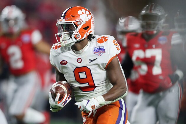 GLENDALE, ARIZONA - DECEMBER 28:  Travis Etienne #9 of the Clemson Tigers carries the ball for a 53-yard touchdown reception against the Ohio State Buckeyes in the second half during the College Football Playoff Semifinal at the PlayStation Fiesta Bowl at State Farm Stadium on December 28, 2019 in Glendale, Arizona. (Photo by Matthew Stockman/Getty Images)