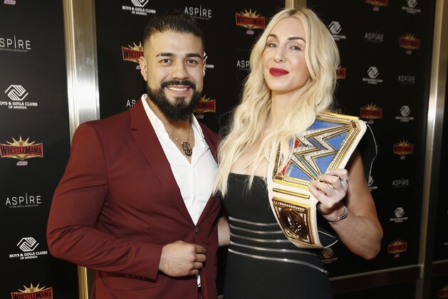 NEW YORK, NEW YORK - APRIL 05: WWE Superstars Andrade and Charlotte Flair attend the WWE Superstars For Hope Reception on April 05, 2019 in New York City. (Photo by Brian Ach/Getty Images for WWE)