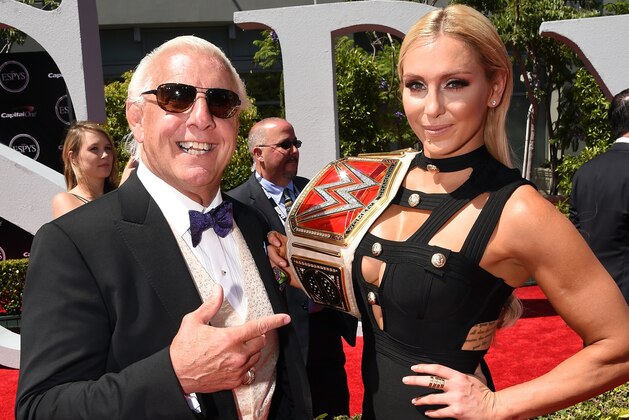 LOS ANGELES, CA - JULY 13:  WWE wrestler Ric Flair (L) and WWE Diva Charlotte attend the 2016 ESPYS at Microsoft Theater on July 13, 2016 in Los Angeles, California.  (Photo by Kevin Winter/Getty Images)