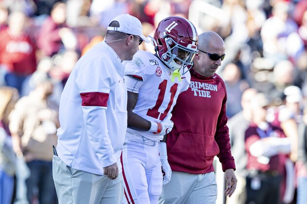 FAYETTEVILLE, AR - NOVEMBER 9:  Henry Ruggs III #11 of the Alabama Crimson Tide is helped off the field after being hurt during a game against the Mississippi State Bulldogs at Davis Wade Stadium on November 16, 2019 in Starkville, Mississippi.  The Crimson Tide defeated the Bulldogs 38-7.  (Photo by Wesley Hitt/Getty Images)
