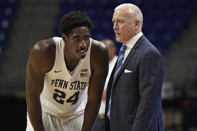 Penn State head coach Patrick Chambers, right, talks with Penn State's Mike Watkins (24) during the second half of an NCAA college basketball game against Central Connecticut State, Friday, Dec. 20, 2019, in State College, Pa. (AP Photo/John Beale)