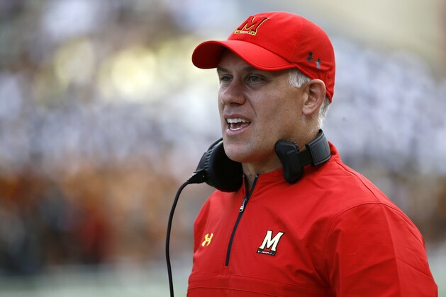FILE - In this Saturday, Sept. 9, 2017, file photo, Maryland head coach DJ Durkin stands on the sideline during an NCAA college football game against Towson in College Park, Md. The University System of Maryland's board of regents announced Tuesday their recommendation that Durkin retain his job. Durkin has been on paid administrative leave since August, following the death of a player who collapsed during practice and an investigation of bullying by the Maryland coaching staff. (AP Photo/Patrick Semansky, File)