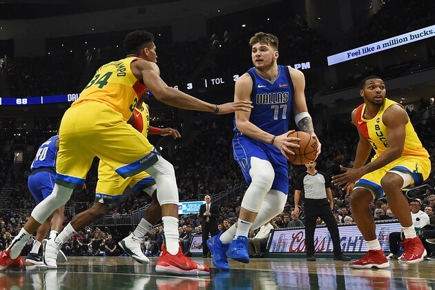 MILWAUKEE, WISCONSIN - JANUARY 21:  Luka Doncic #77 of the Dallas Mavericks works against Giannis Antetokounmpo #34 of the Milwaukee Bucks during a game at Fiserv Forum on January 21, 2019 in Milwaukee, Wisconsin. NOTE TO USER: User expressly acknowledges and agrees that, by downloading and or using this photograph, User is consenting to the terms and conditions of the Getty Images License Agreement. (Photo by Stacy Revere/Getty Images)