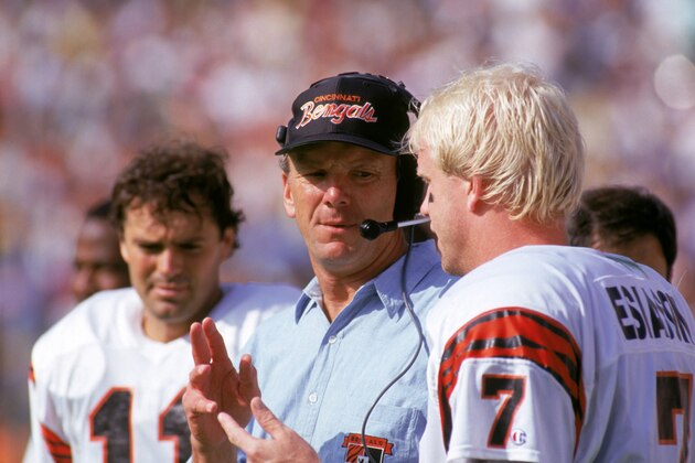 ANAHEIM, CA - OCTOBER 7:  Head coach Sam Wyche of the Cincinnati Bengals talks to his quarterback Boomer Esiason #7 on the sidelines during a game against the Los Angeles Rams at the Anaheim Stadium on October 7, 1990 in Anaheim, California.  The Bengals won 34-31.  (Photo by George Rose/Getty Images)