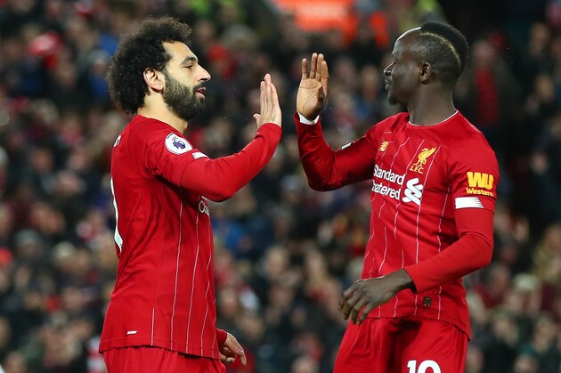 LIVERPOOL, ENGLAND - JANUARY 02: Mohamed Salah of Liverpool celebrates with Sadio Mane after scoring his team's first goal during the Premier League match between Liverpool FC and Sheffield United at Anfield on January 02, 2020 in Liverpool, United Kingdom. (Photo by Clive Brunskill/Getty Images)