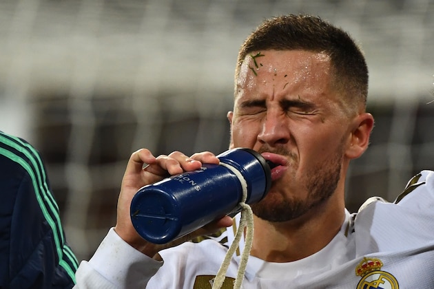 Real Madrid's Belgian forward Eden Hazard gestures in pain during the UEFA Champions League group A football match Real Madrid against Paris Saint-Germain FC at the Santiago Bernabeu stadium in Madrid on November 26, 2019. (Photo by GABRIEL BOUYS / AFP) (Photo by GABRIEL BOUYS/AFP via Getty Images)