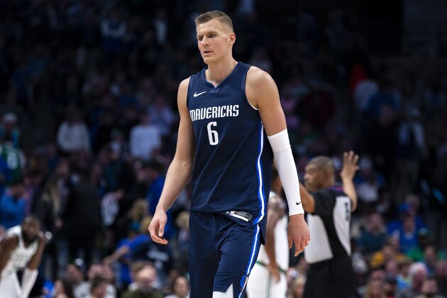 Dallas Mavericks forward Kristaps Porzingis walks off the court after fouling out during the second half of the team's NBA basketball game against the Boston Celtics on Wednesday, Dec. 18, 2019, in Dallas. (AP Photo/Sam Hodde)