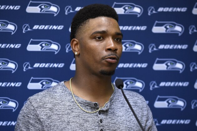 FILE- In this Aug. 13, 2016, file photo Seattle Seahawks quarterback Trevone Boykin speaks during a news conference following an NFL preseason football game against the Kansas City Chiefs in Kansas City, Mo. The former Texas Christian University quarterback Boykin has been formally charged on Friday, Sept. 28, 2018, with aggravated assault for allegedly attacking his girlfriend and breaking her jaw at his home in March. He denies the allegations. The Seattle Seahawks released the 24-year-old Boykin from the team's practice squad shortly after reports of the attack surfaced. (AP Photo/Ed Zurga, File) FILE- In this Aug. 13, 2016, file photo Seattle Seahawks quarterback Trevone Boykin speaks during a news conference following an NFL preseason football game against the Kansas City Chiefs in Kansas City, Mo. The former Texas Christian University quarterback Boykin has been formally charged on Friday, Sept. 28, 2018, with aggravated assault for allegedly attacking his girlfriend and breaking her jaw at his home in March. He denies the allegations. The Seattle Seahawks released the 24-year-old Boykin from the team's practice squad shortly after reports of the attack surfaced. (AP Photo/Ed Zurga, File)