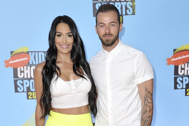 Nikki Bella, left, and Artem Chigvintsev arrive at the Kids' Choice Sports Awards on Thursday, July 11, 2019, at the Barker Hangar in Santa Monica, Calif. (Photo by Richard Shotwell/Invision/AP)