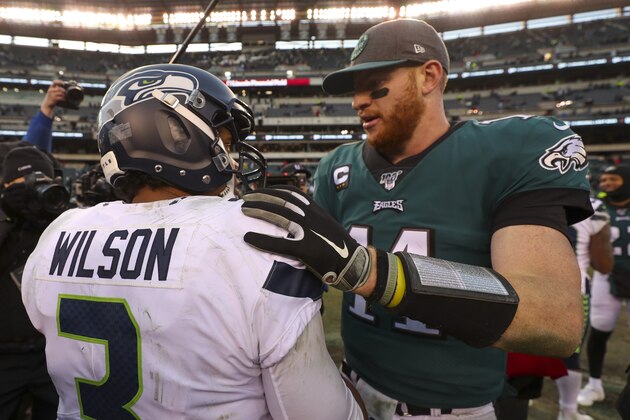 PHILADELPHIA, PA - NOVEMBER 24: Russell Wilson #3 of the Seattle Seahawks hugs Carson Wentz #11 of the Philadelphia Eagles after the game at Lincoln Financial Field on November 24, 2019 in Philadelphia, Pennsylvania. (Photo by Mitchell Leff/Getty Images)