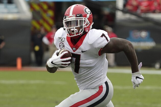 Georgia running back D'Andre Swift gains yardage against Florida during the first half of an NCAA college football game, Saturday, Nov. 2, 2019, in Jacksonville, Fla. (AP Photo/John Raoux)