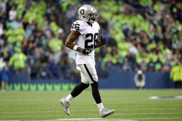 SEATTLE, WASHINGTON - AUGUST 29: Nevin Lawson #26 of the Oakland Raiders looks on against the Seattle Seahawks in the first half during their NFL preseason game at CenturyLink Field on August 29, 2019 in Seattle, Washington. (Photo by Abbie Parr/Getty Images)