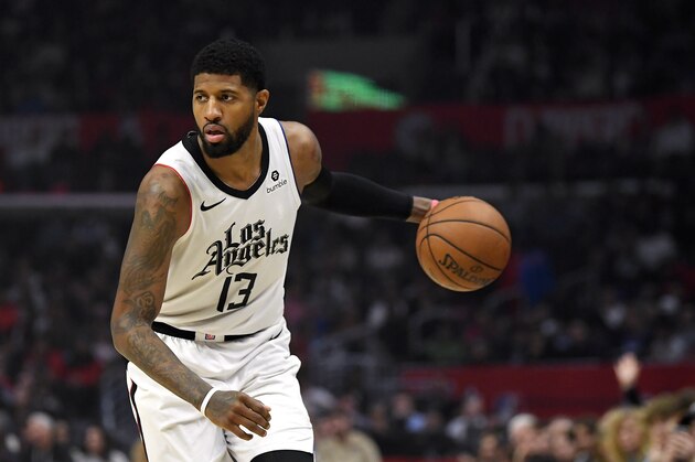 Los Angeles Clippers forward Paul George dribbles during the first half of an NBA basketball game against the Detroit Pistons Thursday, Jan. 2, 2020, in Los Angeles. (AP Photo/Mark J. Terrill)