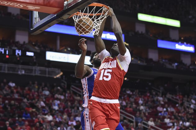 Houston Rockets center Clint Capela (15) dunks as Philadelphia 76ers center Joel Embiid watches during the first half of an NBA basketball game Friday, Jan. 3, 2020, in Houston. (AP Photo/Eric Christian Smith) Houston Rockets center Clint Capela (15) dunks as Philadelphia 76ers center Joel Embiid watches during the first half of an NBA basketball game Friday, Jan. 3, 2020, in Houston. (AP Photo/Eric Christian Smith)