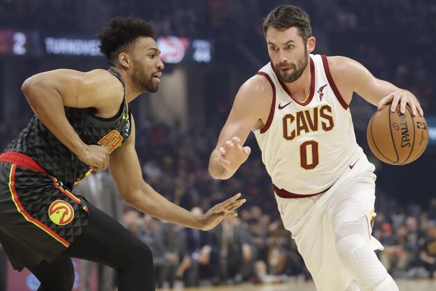 Cleveland Cavaliers' Kevin Love (0) drives against Atlanta Hawks' Jabari Parker during the first half of an NBA basketball game Monday, Dec. 23, 2019, in Cleveland. (AP Photo/Tony Dejak)