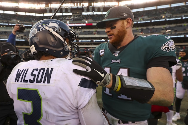 PHILADELPHIA, PA - NOVEMBER 24: Russell Wilson #3 of the Seattle Seahawks hugs Carson Wentz #11 of the Philadelphia Eagles after the game at Lincoln Financial Field on November 24, 2019 in Philadelphia, Pennsylvania. (Photo by Mitchell Leff/Getty Images)