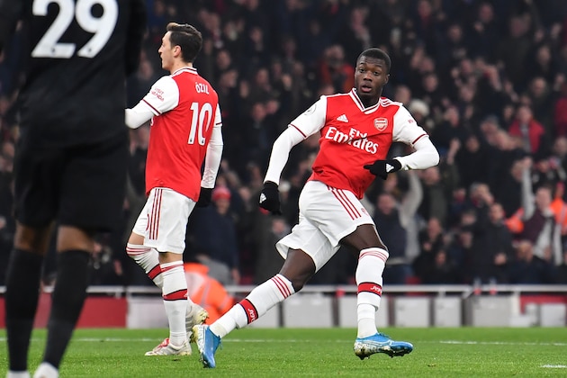 Arsenal's French-born Ivorian midfielder Nicolas Pepe turns to celebrate after scoring the opening goal of the English Premier League football match between Arsenal and Manchester United at the Emirates Stadium in London on January 1, 2020. (Photo by Ben STANSALL / AFP) / RESTRICTED TO EDITORIAL USE. No use with unauthorized audio, video, data, fixture lists, club/league logos or 'live' services. Online in-match use limited to 120 images. An additional 40 images may be used in extra time. No video emulation. Social media in-match use limited to 120 images. An additional 40 images may be used in extra time. No use in betting publications, games or single club/league/player publications. /  (Photo by BEN STANSALL/AFP via Getty Images)