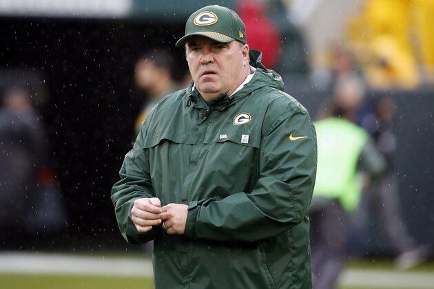 Green Bay Packers head coach Mike McCarthy walks around the field as his players warm up before an NFL football game against the New Orleans Saints, Sunday, Oct. 22, 2017, in Green Bay, Wis. (AP Photo/Mike Roemer)