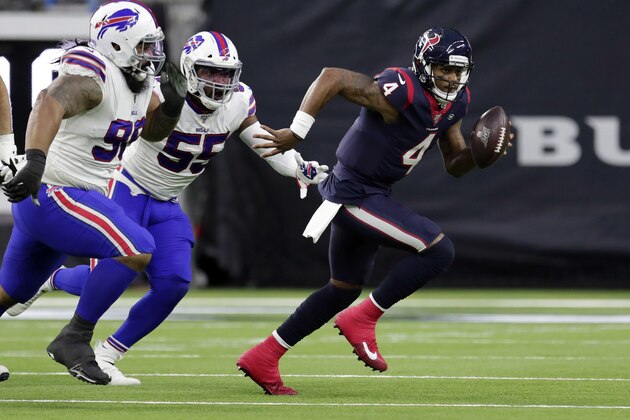 Houston Texans quarterback Deshaun Watson (4) breaks away from Buffalo Bills defensive end Jerry Hughes (55) and defensive tackle Star Lotulelei (98) during the second half of an NFL wild-card playoff football game Saturday, Jan. 4, 2020, in Houston. (AP Photo/Michael Wyke)