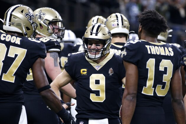 New Orleans Saints quarterback Drew Brees (9) celebrates his touchdown pass to tight end Josh Hill, which broke the NFL record for career touchdown passes, surpassing Peyton Manning, in the second half of an NFL football game against the Indianapolis Colts in New Orleans, Monday, Dec. 16, 2019. (AP Photo/Butch Dill)