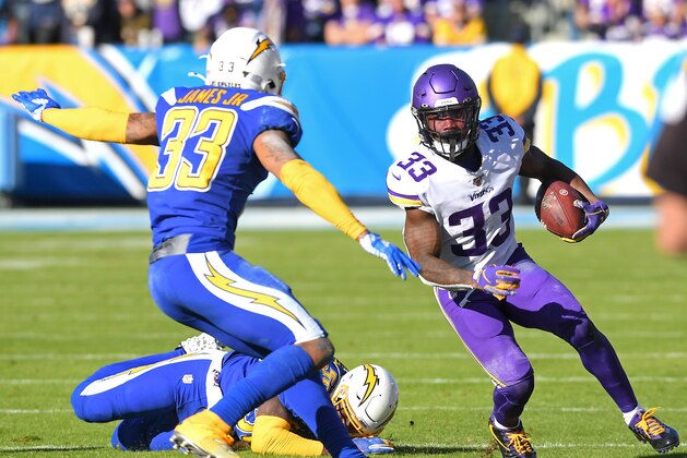 CARSON, CA - DECEMBER 15: Running back Dalvin Cook #33 of the Minnesota Vikings runs the ball before he is stopped by free safety Derwin James #33 of the Los Angeles Chargers in the first half at Dignity Health Sports Park on December 15, 2019 in Carson, California. (Photo by Jayne Kamin-Oncea/Getty Images)