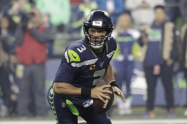 Seattle Seahawks quarterback Russell Wilson looks for room to pass against the San Francisco 49ers during the first half of an NFL football game, Sunday, Dec. 29, 2019, in Seattle. (AP Photo/Ted S. Warren)