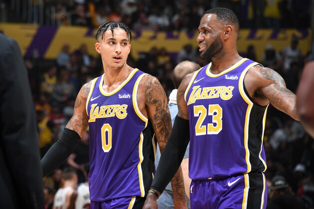 LOS ANGELES, CA - NOVEMBER 8: Kyle Kuzma #0, and LeBron James #23 of the Los Angeles Lakers talk to each other against the Miami Heat on November 8, 2019 at STAPLES Center in Los Angeles, California. NOTE TO USER: User expressly acknowledges and agrees that, by downloading and/or using this Photograph, user is consenting to the terms and conditions of the Getty Images License Agreement. Mandatory Copyright Notice: Copyright 2019 NBAE (Photo by Andrew D. Bernstein/NBAE via Getty Images)