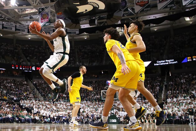 EAST LANSING, MICHIGAN - JANUARY 05: Cassius Winston #5 of the Michigan State Spartans drives the basket past Brandon Johns Jr. #23 of the Michigan Wolverines during the first half at Breslin Center on January 05, 2020 in East Lansing, Michigan. (Photo by Gregory Shamus/Getty Images) EAST LANSING, MICHIGAN - JANUARY 05: Cassius Winston #5 of the Michigan State Spartans drives the basket past Brandon Johns Jr. #23 of the Michigan Wolverines during the first half at Breslin Center on January 05, 2020 in East Lansing, Michigan. (Photo by Gregory Shamus/Getty Images)