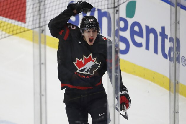 Canada's Dylan Cozens celebrates after scoring his sides first goal during the U20 Ice Hockey Worlds gold medal match between Canada and Russia in Ostrava, Czech Republic, Sunday, Jan. 5, 2020. (AP Photo/Petr David Josek)
