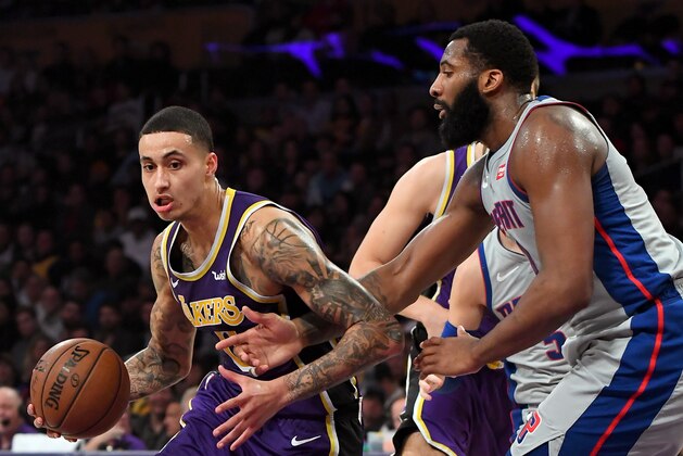 LOS ANGELES, CA - JANUARY 09:  Andre Drummond #0 of the Detroit Pistons defends Kyle Kuzma #0 of the Los Angeles Lakers as he drives to the basket in the second half of the game at Staples Center on January 9, 2019 in Los Angeles, California. NOTE TO USER: User expressly acknowledges and agrees that, by downloading and/or using this Photograph, user is consenting to the terms and conditions of the Getty Images License Agreement.(Photo by Jayne Kamin-Oncea/Getty Images)