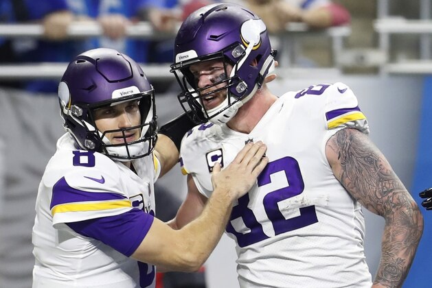 Minnesota Vikings quarterback Kirk Cousins (8) pats tight end Kyle Rudolph (82) after Rudolph scored a touch down during the second half of an NFL football game against the Detroit Lions, Sunday, Dec. 23, 2018, in Detroit. (AP Photo/Rey Del Rio)